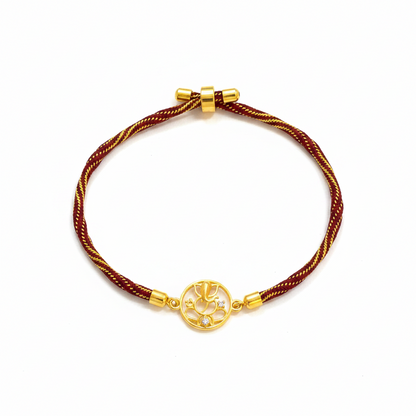 Gold Plated Ganesha Rakhi for Brother | Circular Cutwork Motif with Maroon Thread