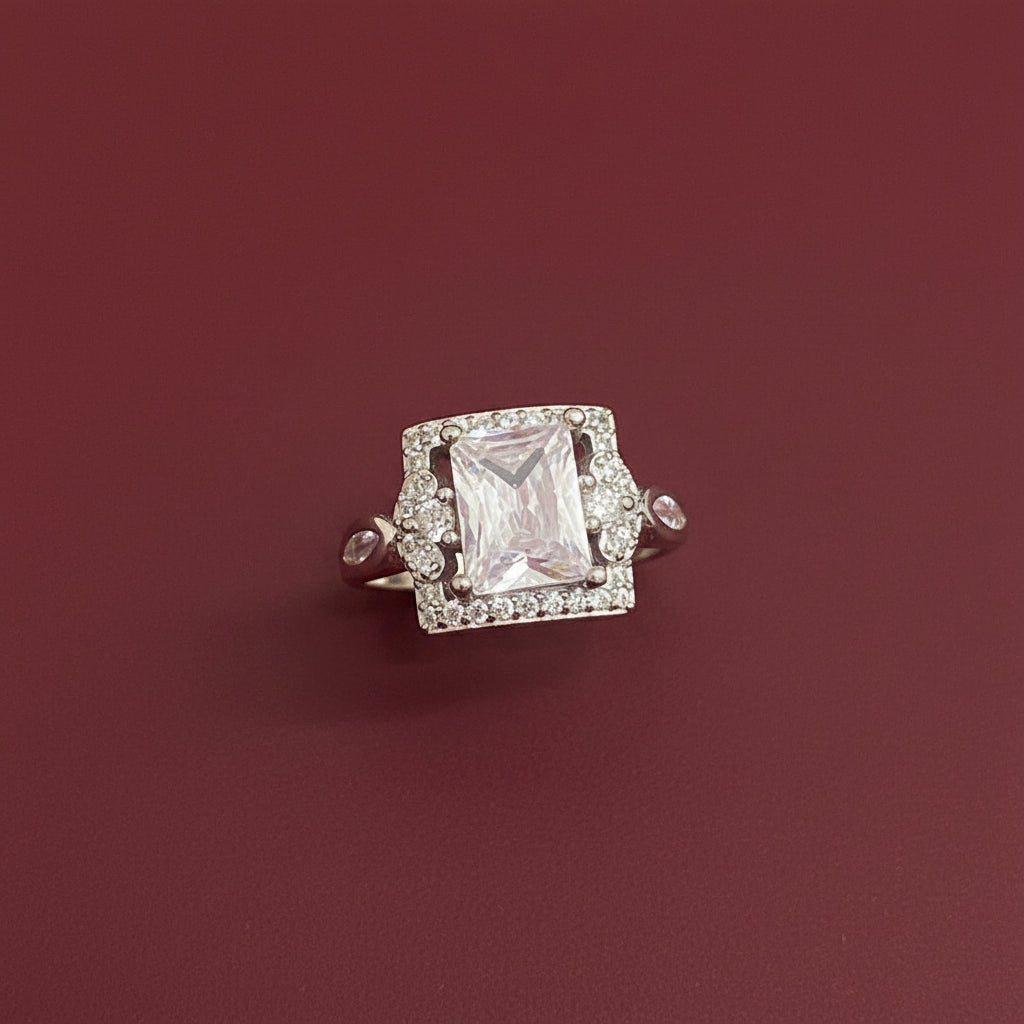 Diamond brooch on a textured green fabric background