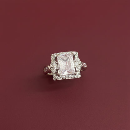Diamond brooch on a textured green fabric background