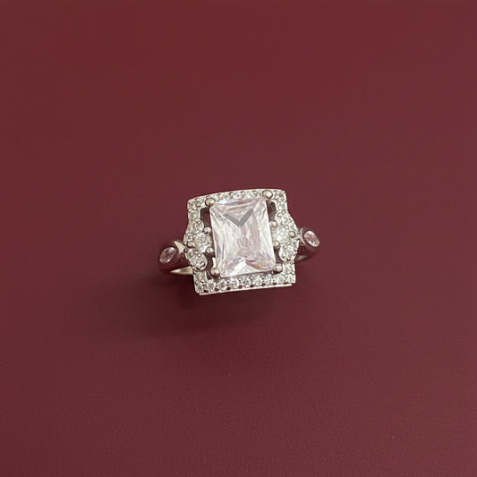 Diamond brooch on a textured green fabric background