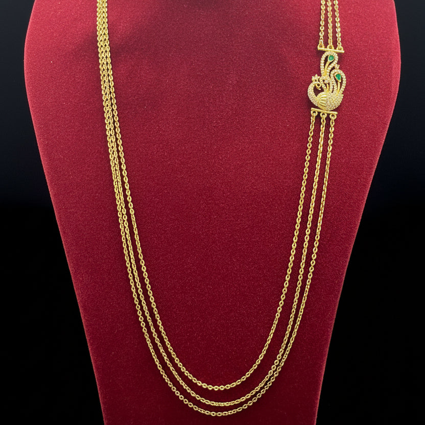 Gold necklace on a red fabric background