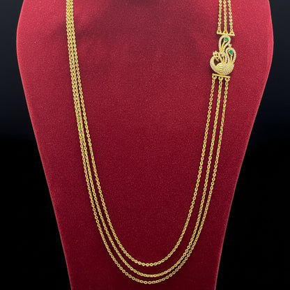 Gold necklace on a red fabric background