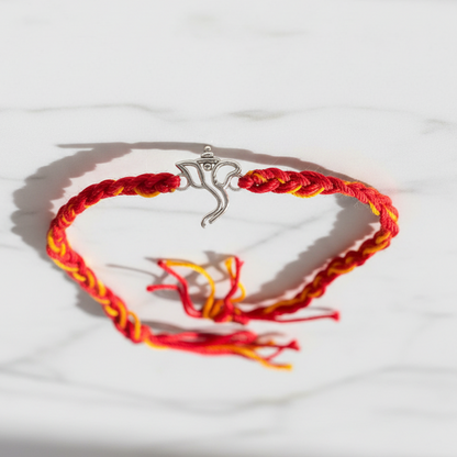 925 Sterling Silver Ganesha Face Rakhi | Red & Yellow Thread Rakhi for Raksha Bandhan
