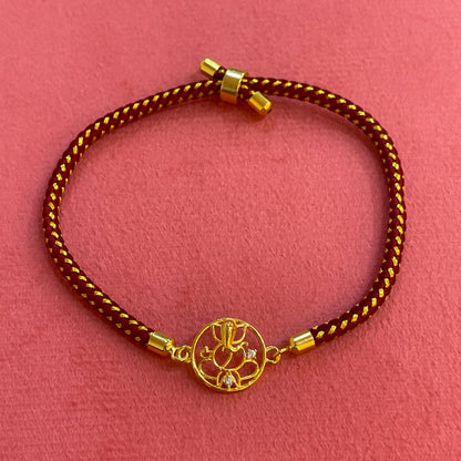 925 Silver Ganesha Rakhi for Brother | Gold Plated Circular Charm on Maroon Thread