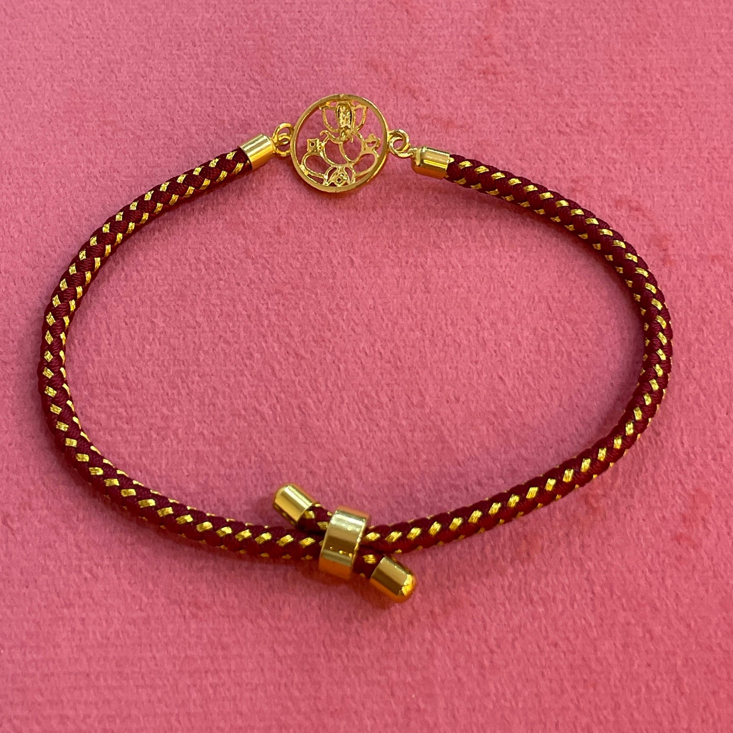 925 Silver Ganesha Rakhi for Brother | Gold Plated Circular Charm on Maroon Thread