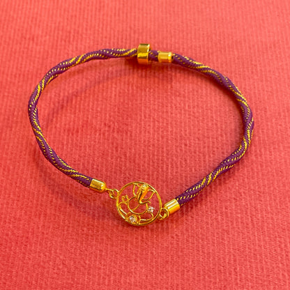 Silver Ganesha Rakhi for Brother | Gold Plated Open Frame Ganesh Charm on Purple & Gold Thread