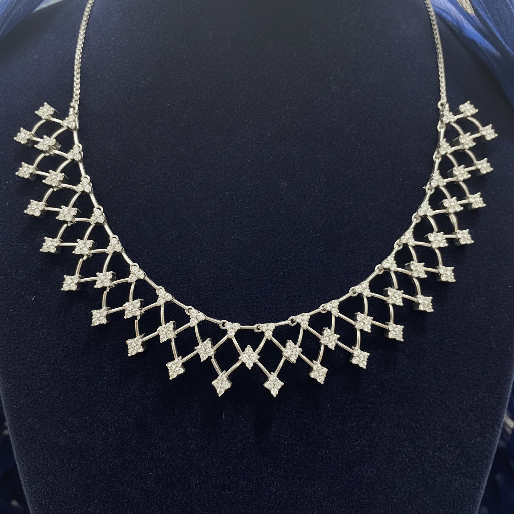 Silver necklace on a red fabric background