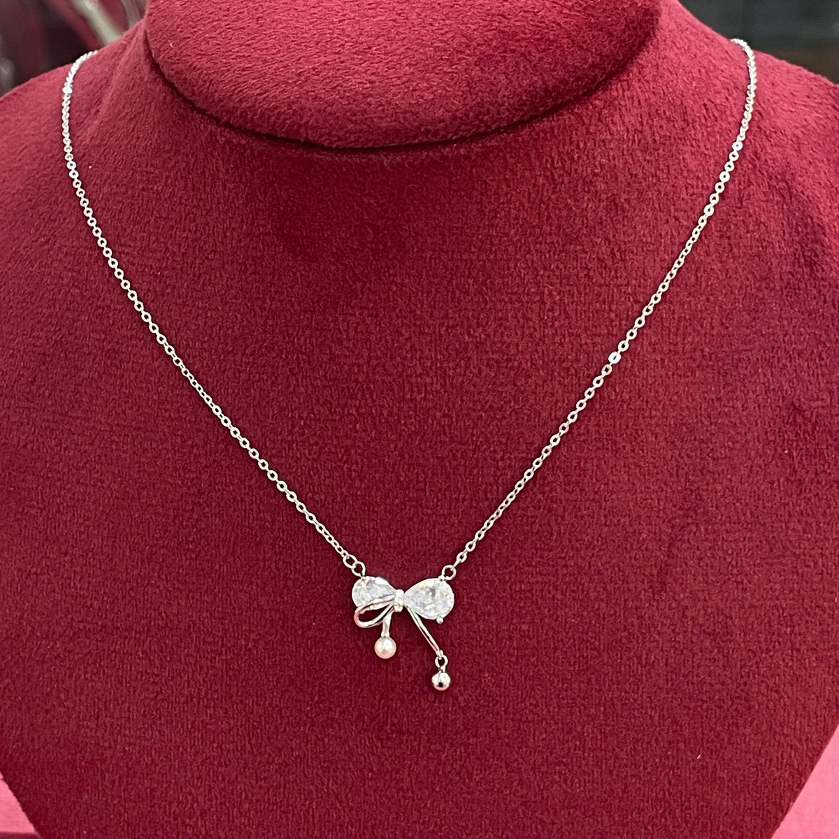 92.5 Silver Pave CZ Bow Pendant Necklace with Pearl & Silver Ball Drops for Women