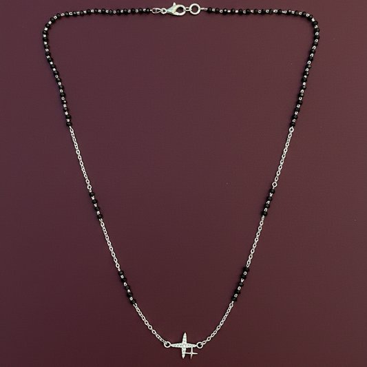 Necklace with a star pendant on a red fabric background