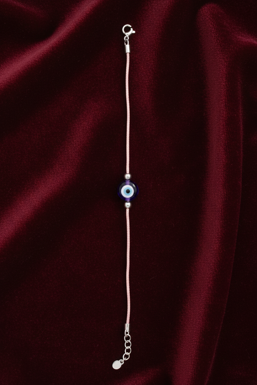 bracelet with a blue evil eye pendant on a white background