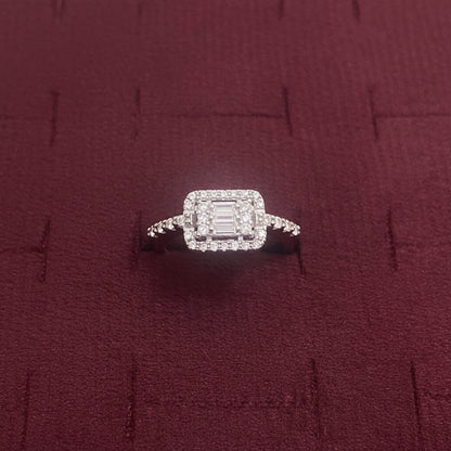 Diamond ring on a blue textured surface