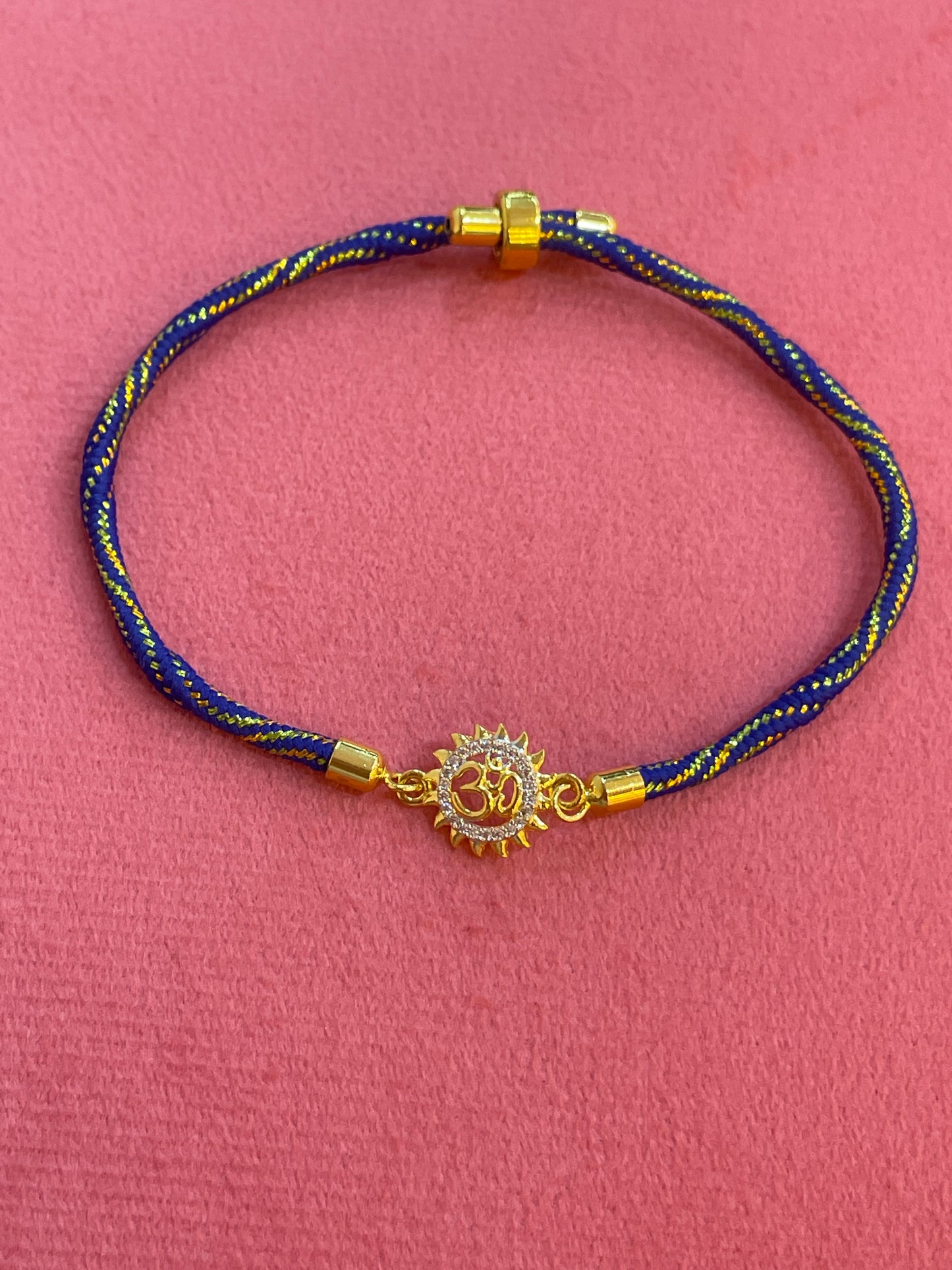 925 Silver Om Sun Rakhi for Brother | Gold Plated Charm on Royal Blue Thread