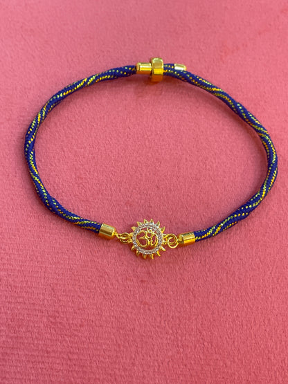 925 Silver Om Sun Rakhi for Brother | Gold Plated Charm on Royal Blue Thread