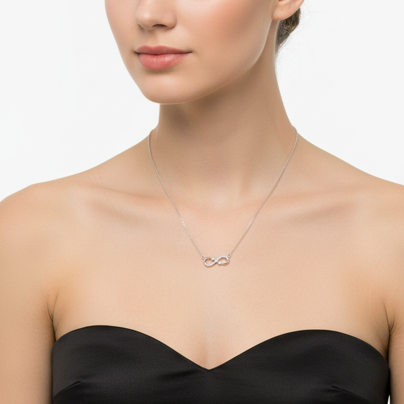 Silver necklace with a unique pendant in a black box on a red fabric background