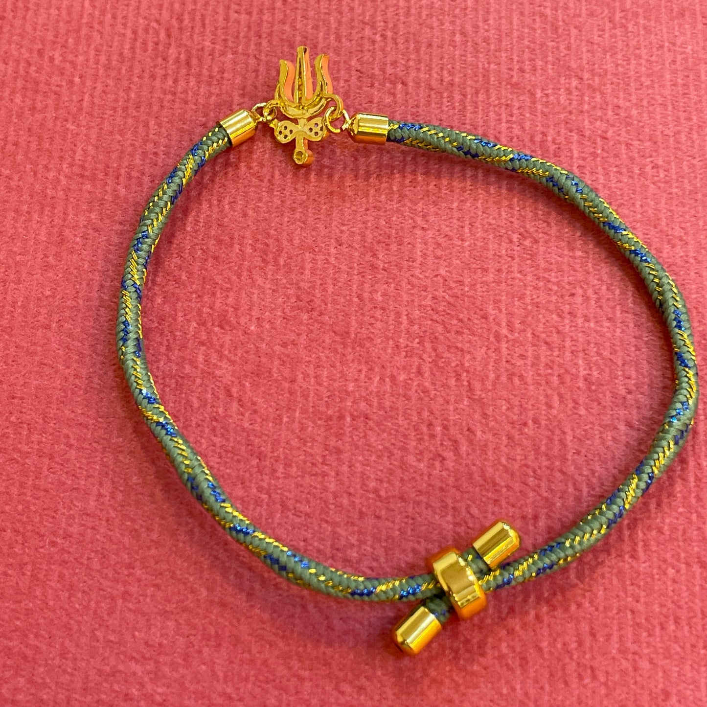 Silver Trishul Rakhi for Brother | Gold Plated Trishul Charm with CZ Stones on Teal Thread