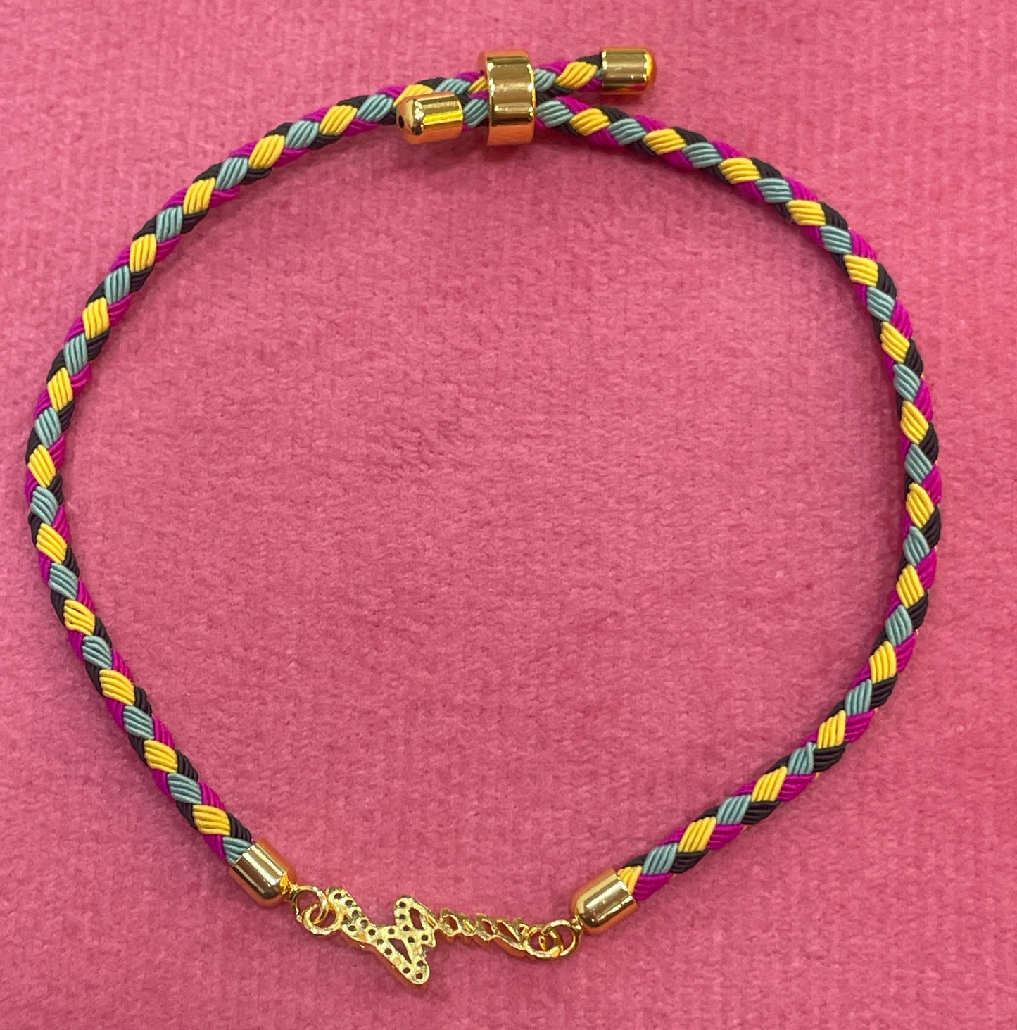 Gold-Plated Rakhi | CZ Name Script Charm on Multicolour Braided Silk Thread