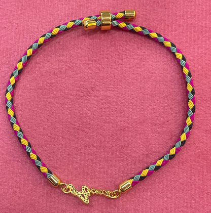 Gold-Plated Rakhi | CZ Name Script Charm on Multicolour Braided Silk Thread