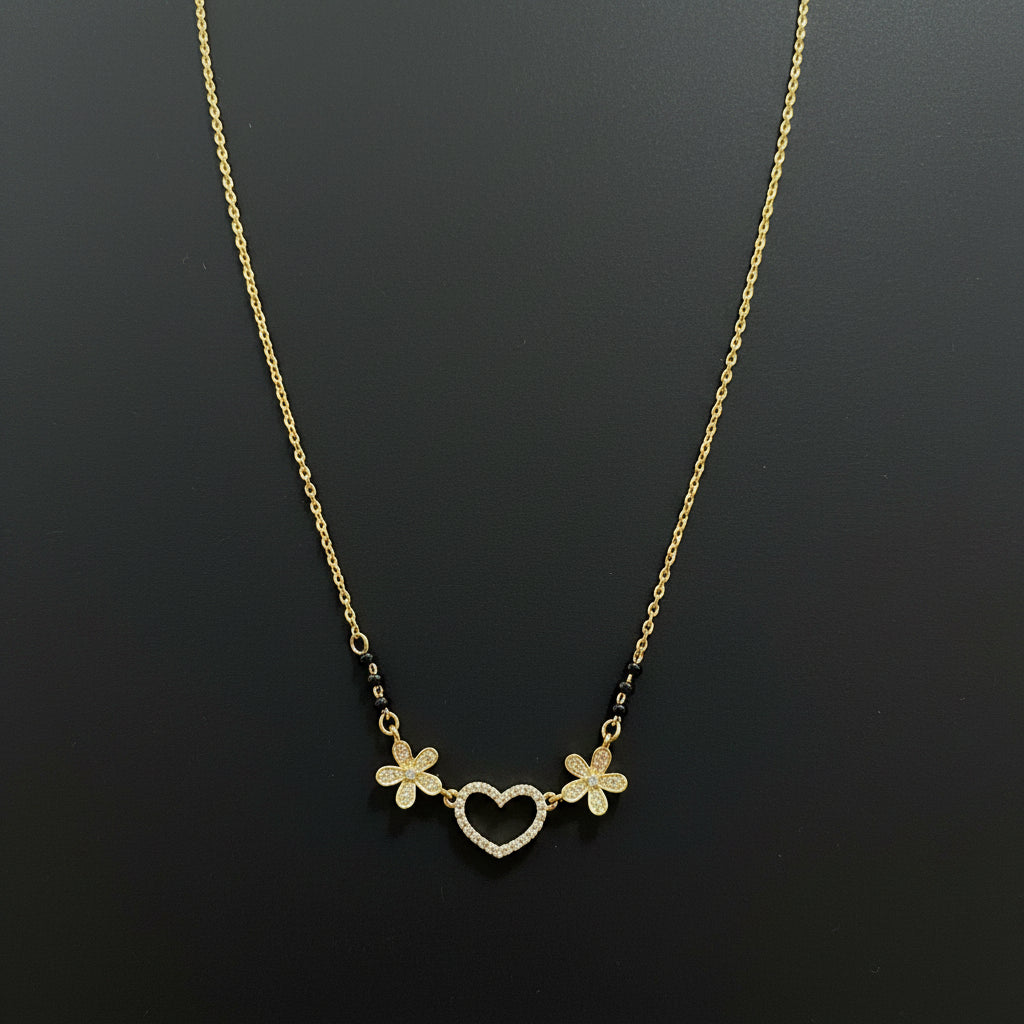Gold necklace with floral designs on a red background