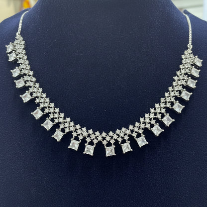 Silver necklace on a red velvet background
