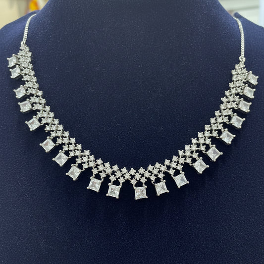Silver necklace on a red velvet background