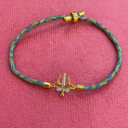 Silver Trishul Rakhi for Brother | Gold Plated Trishul Charm with CZ Stones on Teal Thread