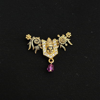 Decorative brooch with intricate design on a blue textured background