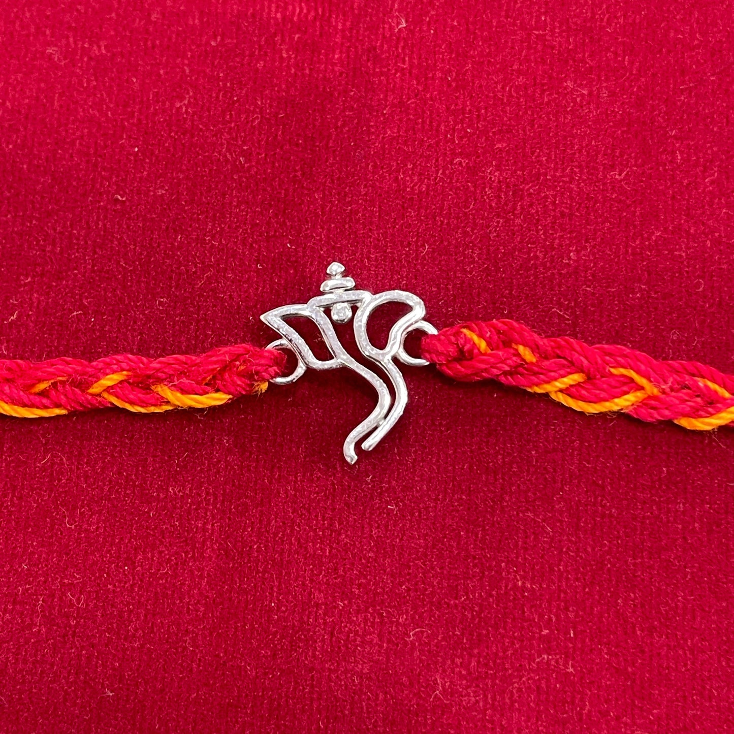 925 Sterling Silver Ganesha Face Rakhi | Red & Yellow Thread Rakhi for Raksha Bandhan