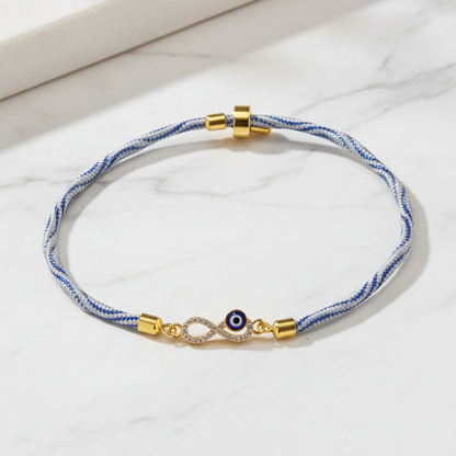 Gold-Plated Rakhi for Brother | CZ Infinity & Evil Eye Charm on Blue Silk Thread