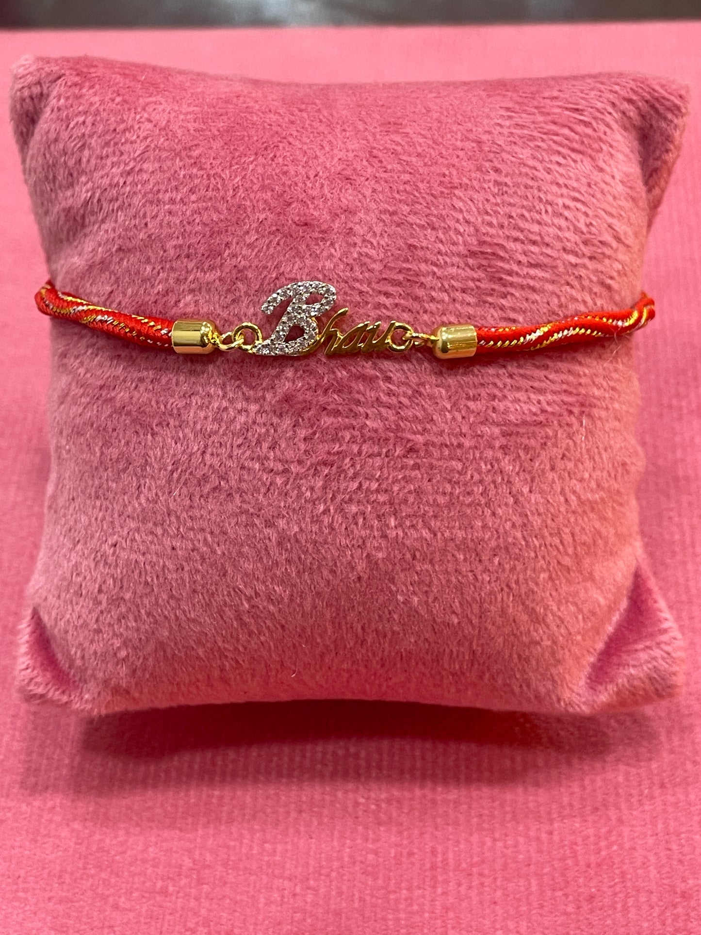 Gold-Plated Bhaiya Name Rakhi for Brother | CZ Script Charm on Red & Gold Twisted Thread