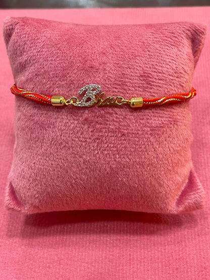 Gold-Plated Bhaiya Name Rakhi for Brother | CZ Script Charm on Red & Gold Twisted Thread