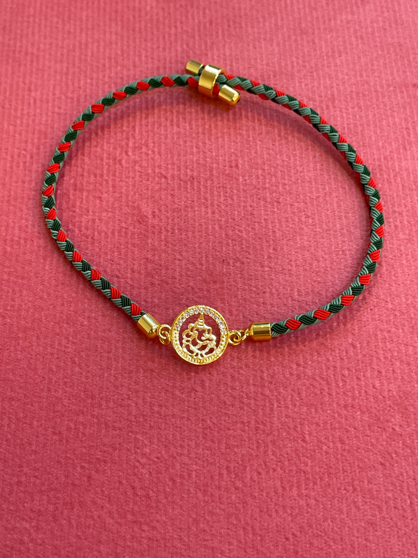 Silver Ganesha Rakhi for Brother | Gold Plated Ganesh Coin Charm on Red & Green Braided Thread