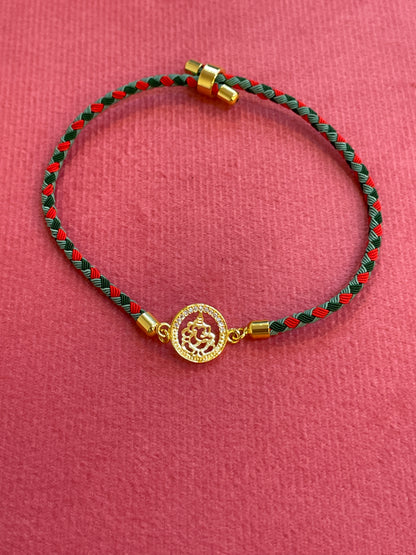 Silver Ganesha Rakhi for Brother | Gold Plated Ganesh Coin Charm on Red & Green Braided Thread