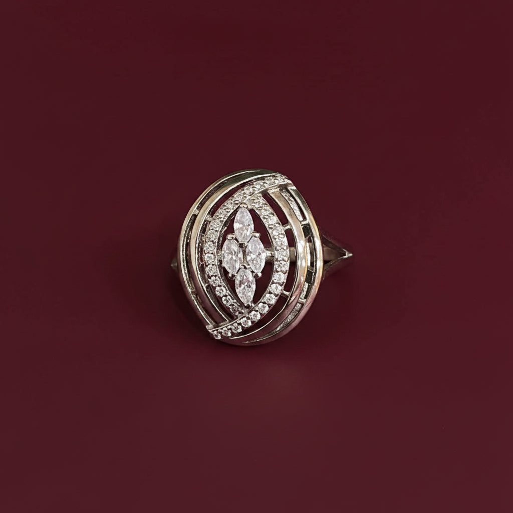 Diamond-studded brooch on a textured blue and red fabric background