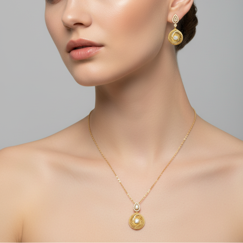 Woman wearing gold necklace and earrings against a gray background