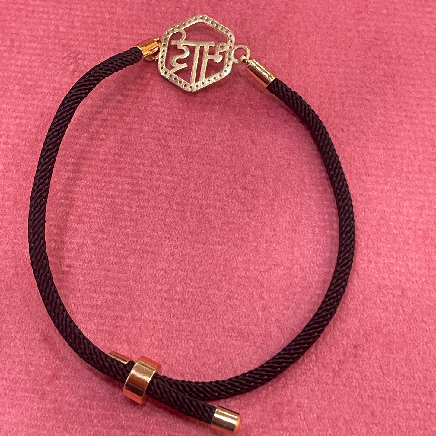 Rose Gold-Plated Rakhi for Brother | CZ Hexagon Bhai Script Charm on Black Silk Thread
