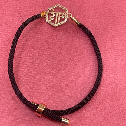 Rose Gold-Plated Rakhi for Brother | CZ Hexagon Bhai Script Charm on Black Silk Thread