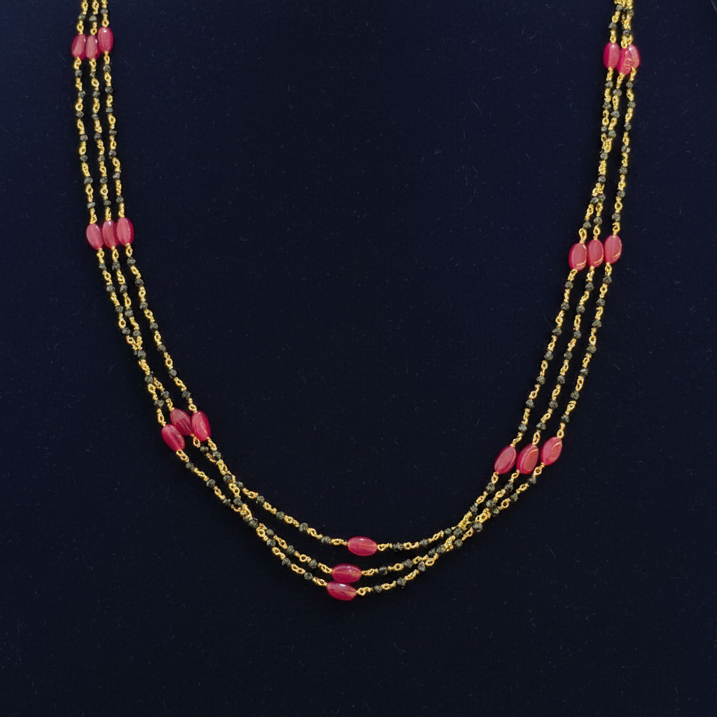 Beaded necklace with pink beads on a red background