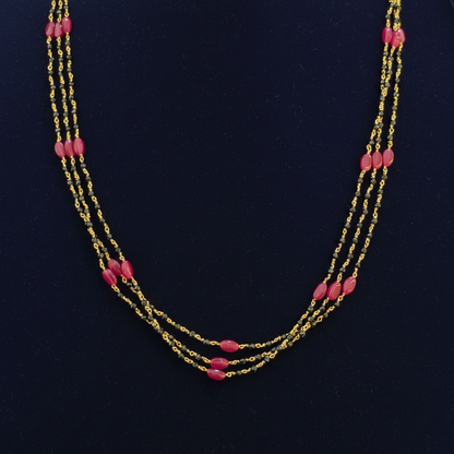 Beaded necklace with pink beads on a red background