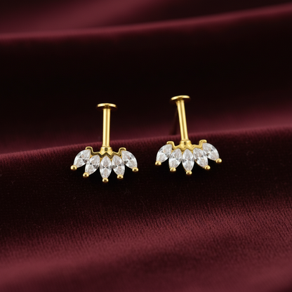 92.5 silver Gold plating bugadi earrings with clear stones on a maroon fabric background