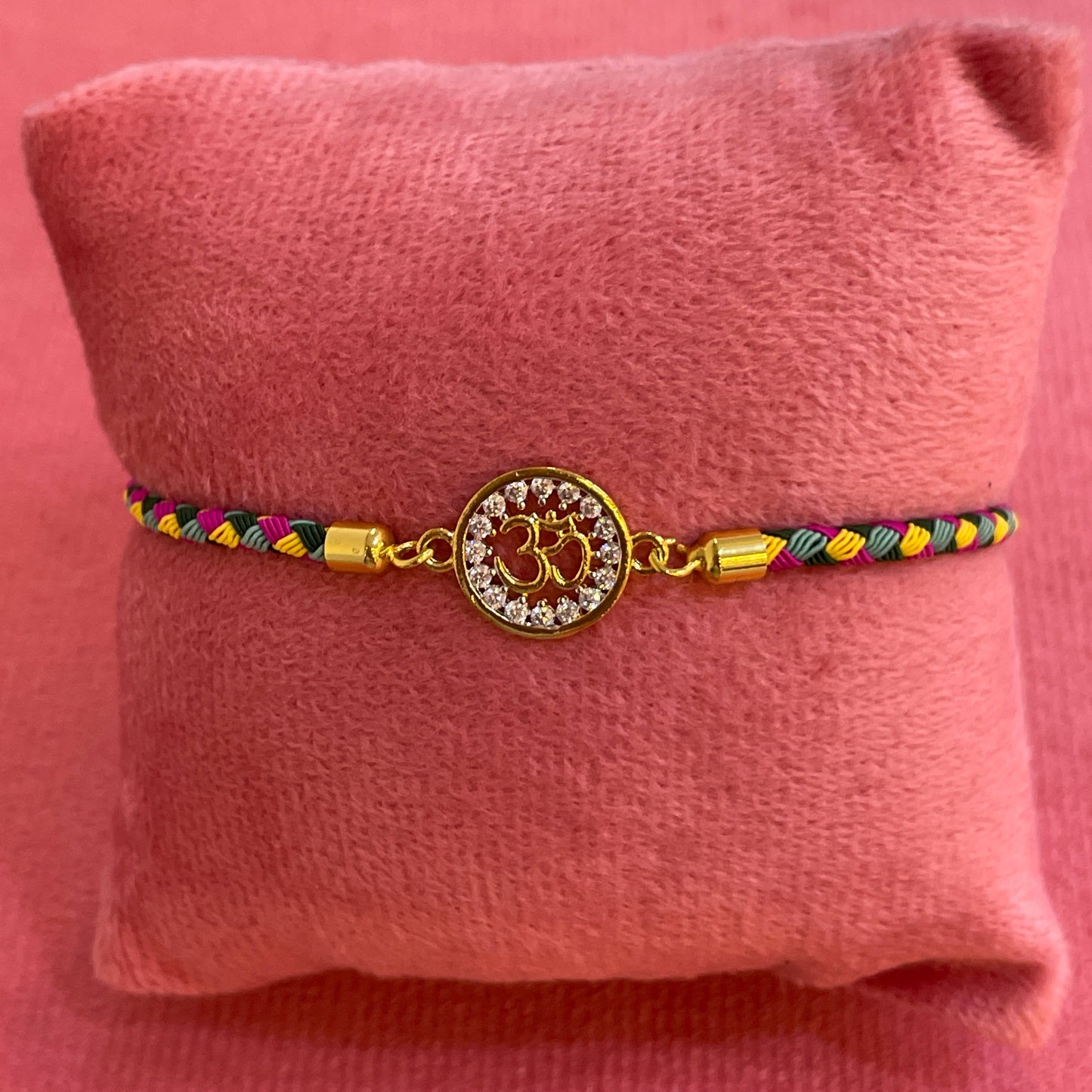 Silver Om Rakhi for Brother | Gold Plated Om Charm with Multicolour Braided Thread