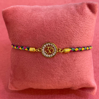 Silver Om Rakhi for Brother | Gold Plated Om Charm with Multicolour Braided Thread