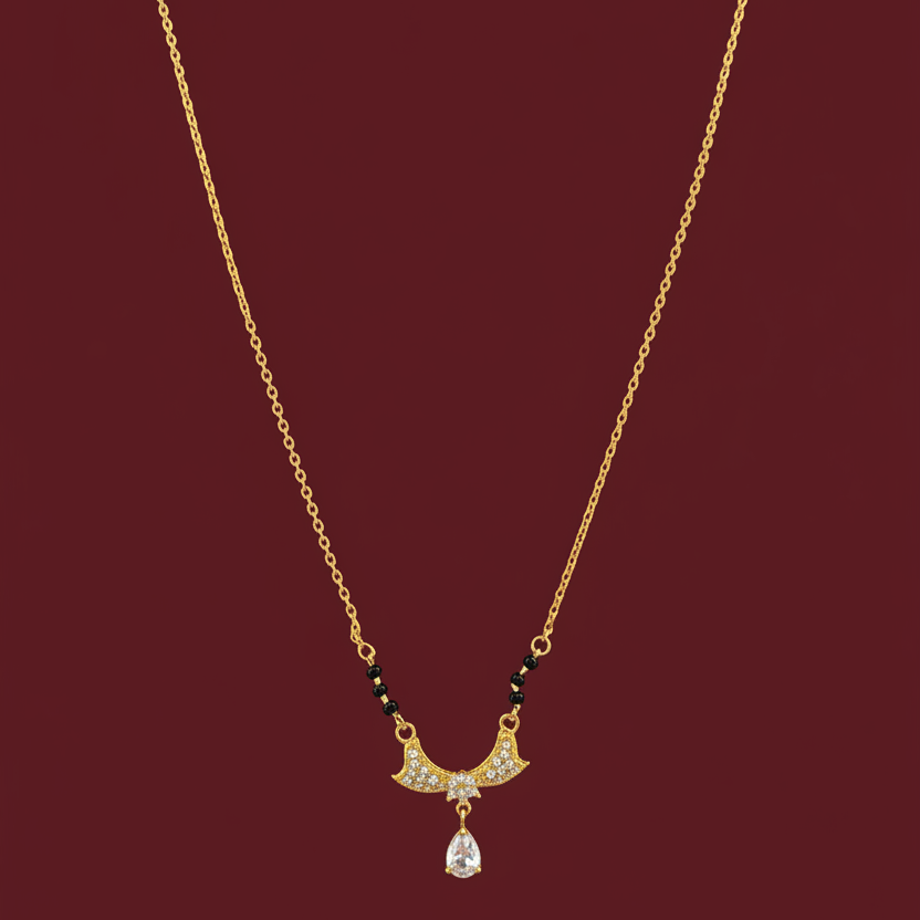Gold necklace with a pendant on a red velvet surface