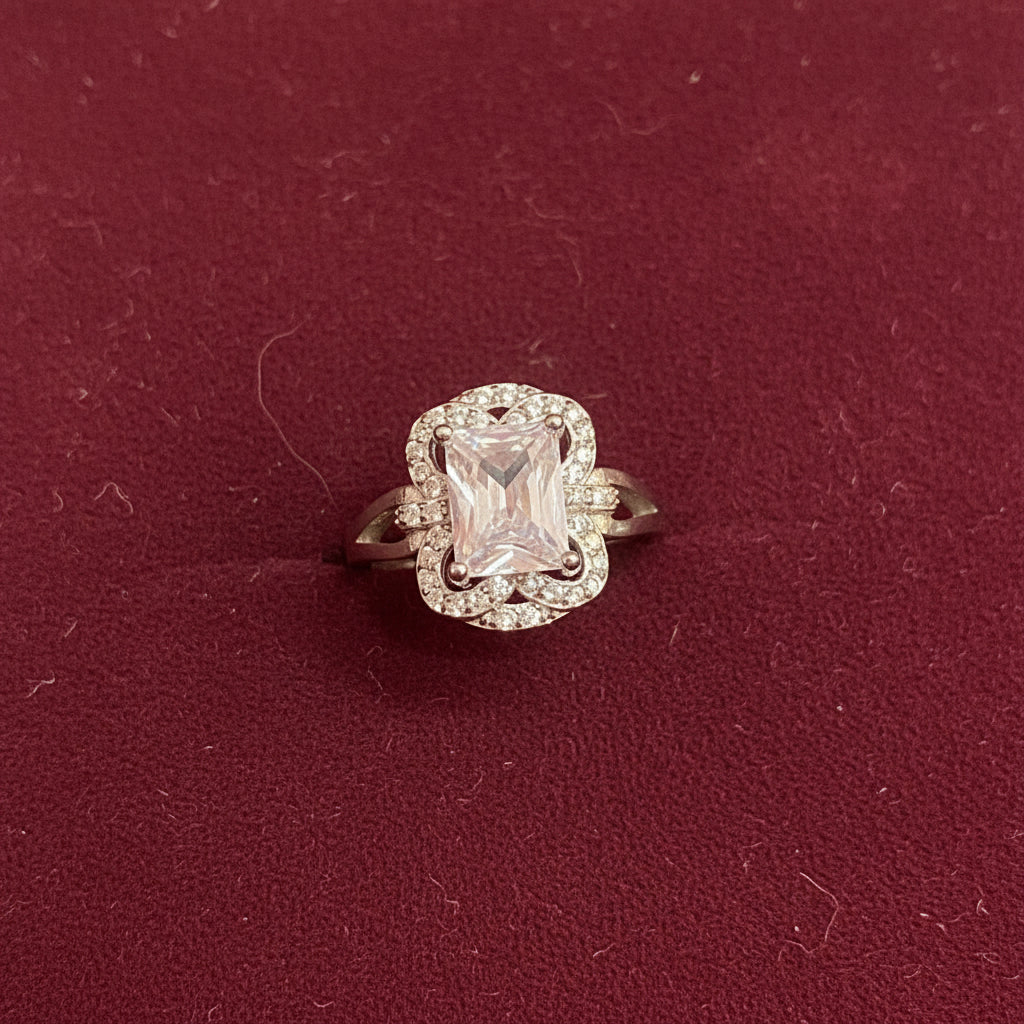 Diamond ring on a green fabric background
