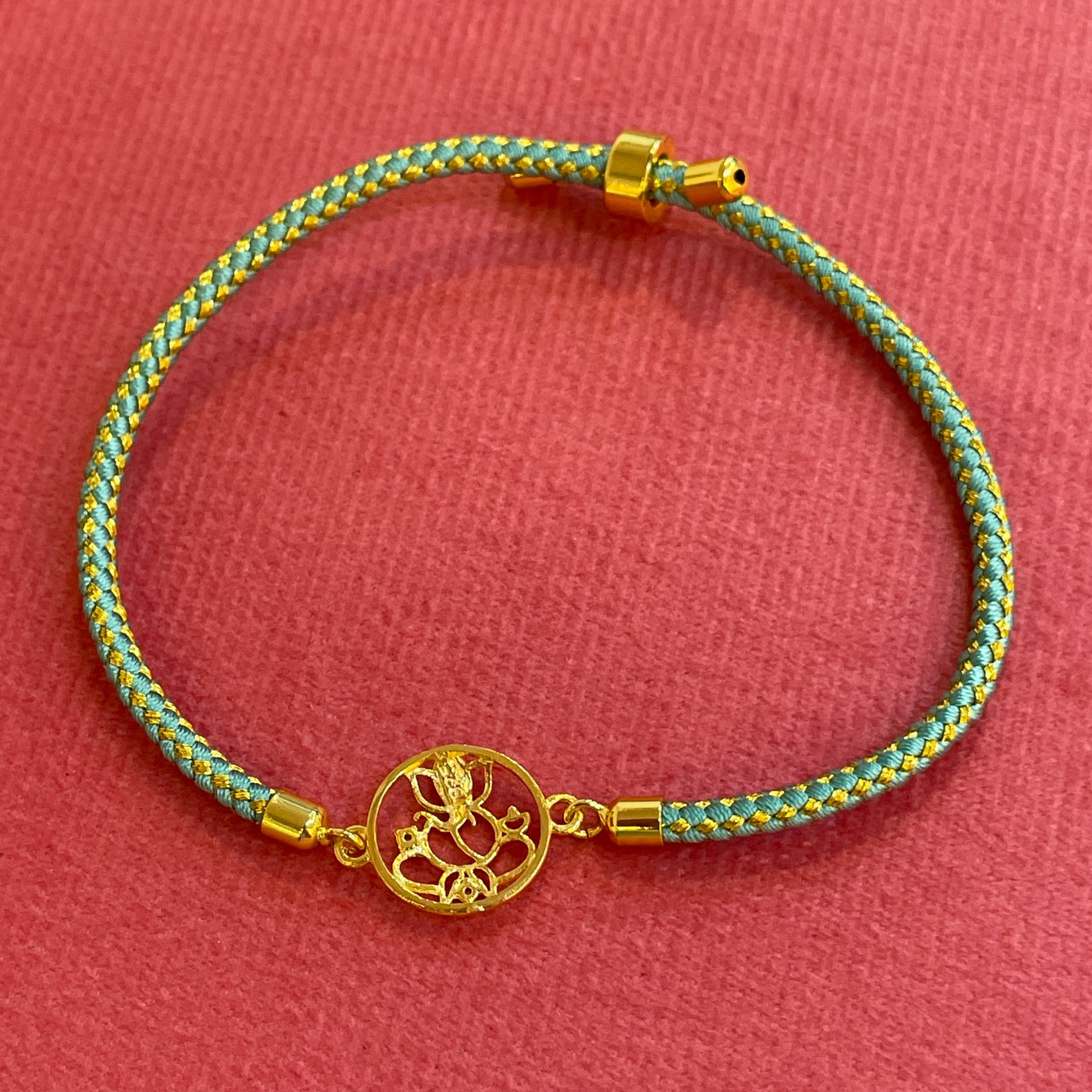 Silver Ganesha Rakhi for Brother | Gold Plated Ganesh Charm with CZ Stones on Teal Thread