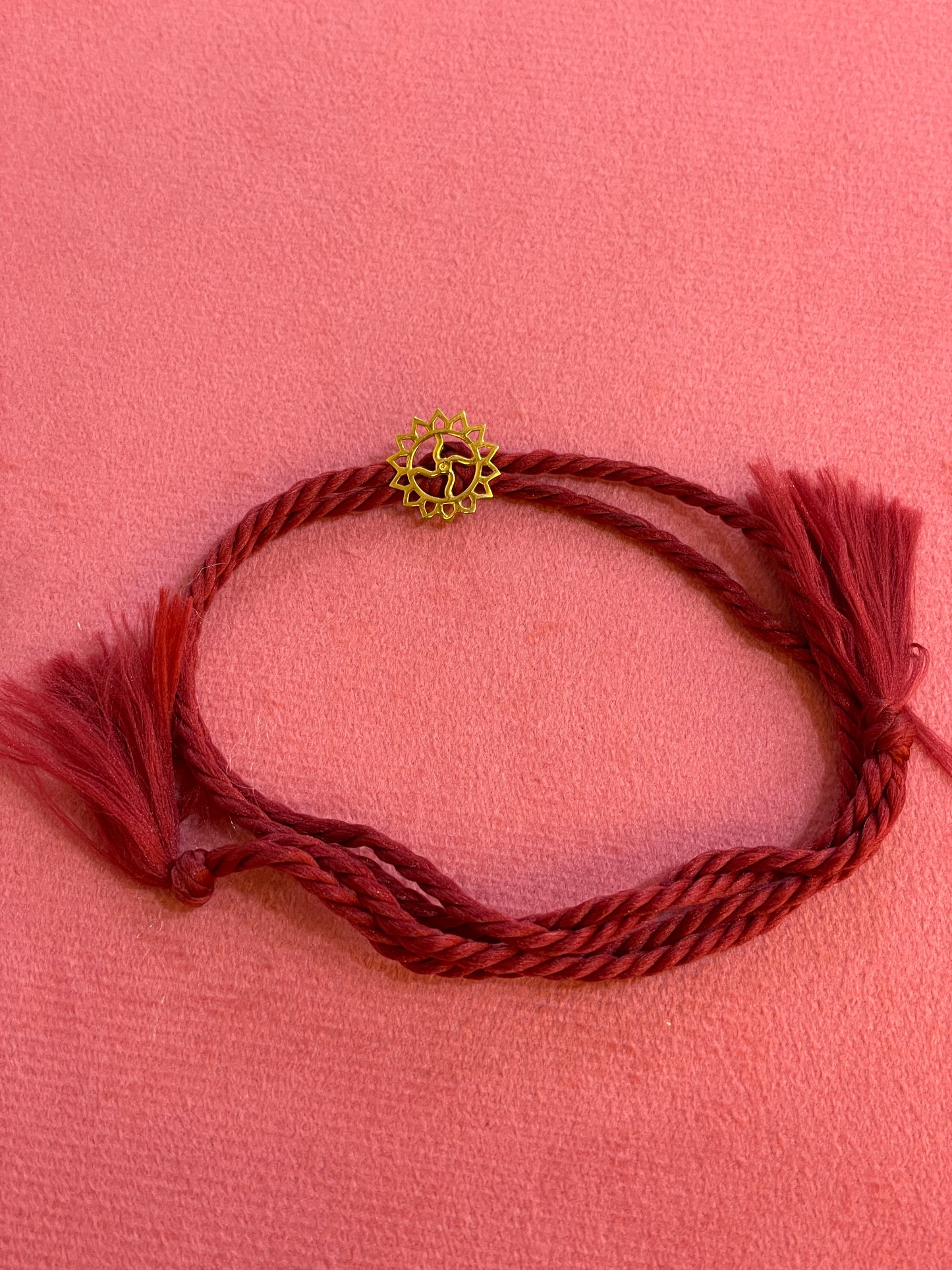 Gold Plated Swastik Rakhi for Brother | Silver Charm with Maroon Thread