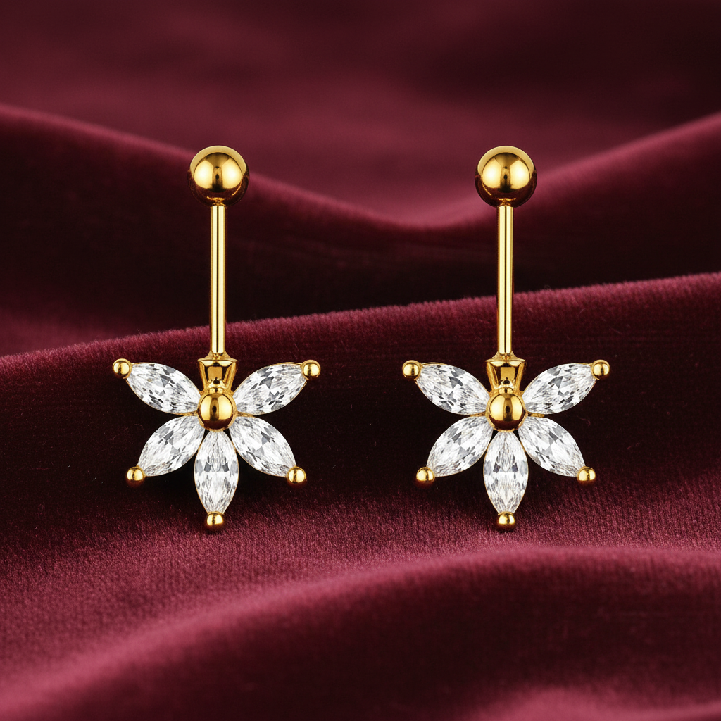 Gold and diamond flower-shaped bugadi earrings on a burgundy fabric background