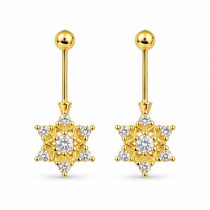 Gold star-shaped bugadi 
earrings with clear gemstones on a white background