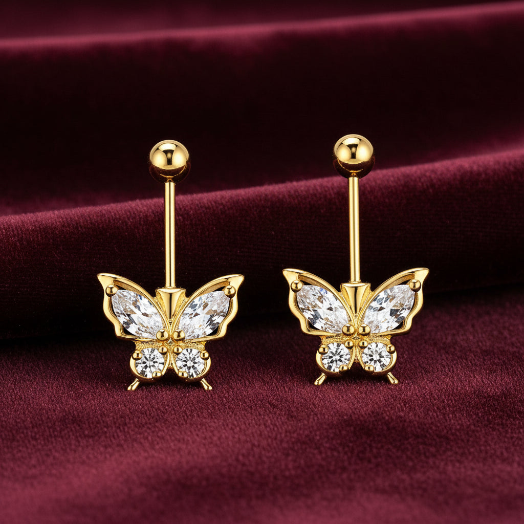 Gold butterfly-shaped bugadi earrings with clear gemstones on a white background