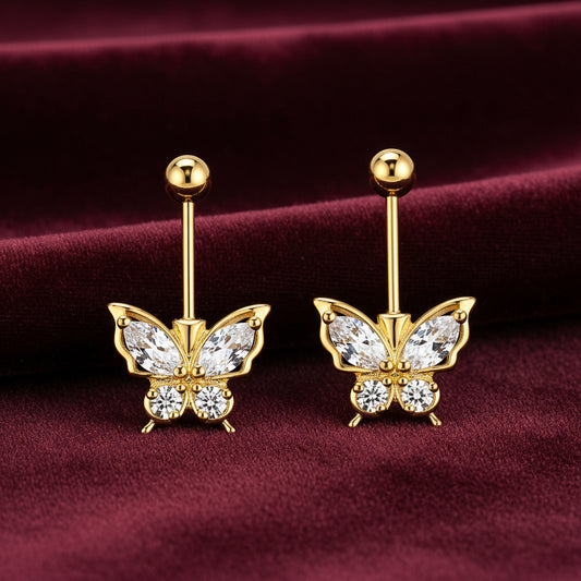 Gold butterfly-shaped bugadi earrings with clear gemstones on a white background
