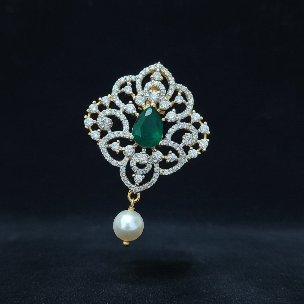 Decorative ring with emerald and pearl on a hand against a red background